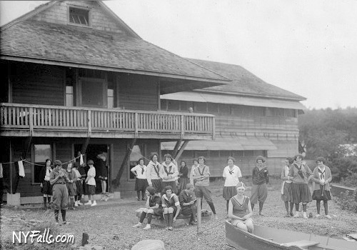 vintage scene of campers in front of a lodge at Camp Onanda in Canandaigua
