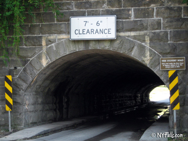 Culvert Road leads through a very small tunnel under the Erie Canal. To the right is a sign marking its uniqueness.