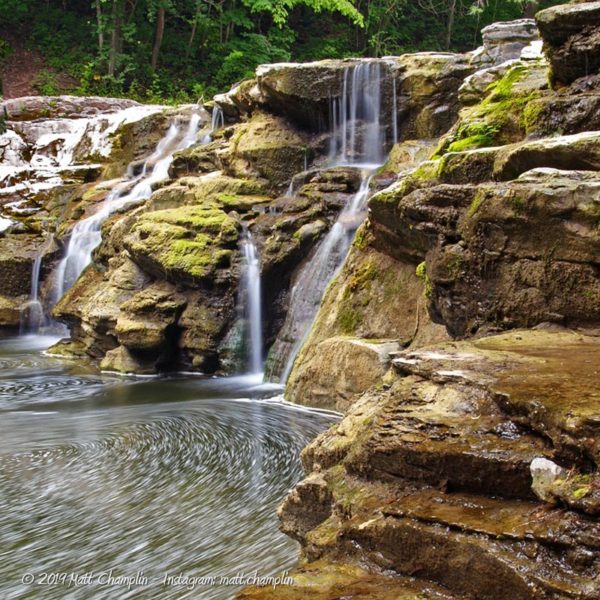 A dry waterfall in Great Gully reveals irregular eroded rock and swilling pool below