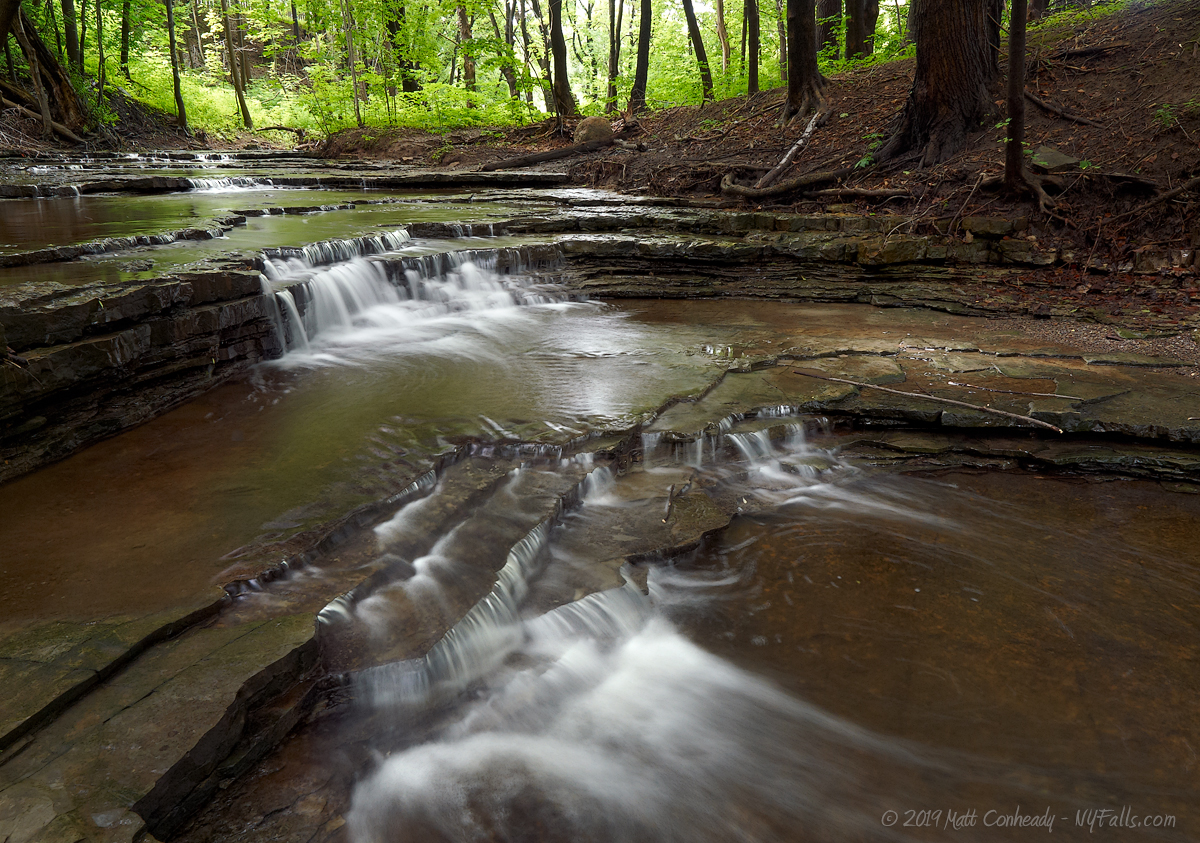 A view of the tiny waterfall steps found upstream from Densmore Falls
