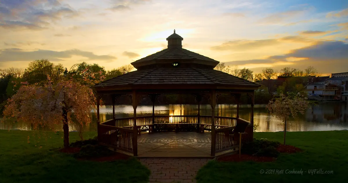 At sunset, a gazebo/pavilion in the park adjacent to the pond on Oatka Creek in LeRoy