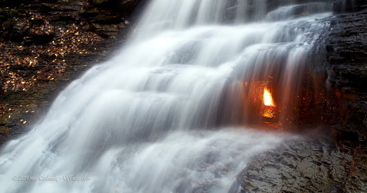A closeup of Eternal Flame Falls with lit flame