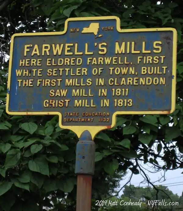 A historic marker for Farwell's Mills in Clarendon reads " Here Eldred Farwell, first white settler of town, built the first mills in Clarendon. Saw mill in 1811. Grist mill in 1813.