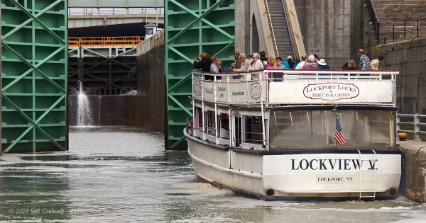 A boat passing through the canal locks at Lockport, NY