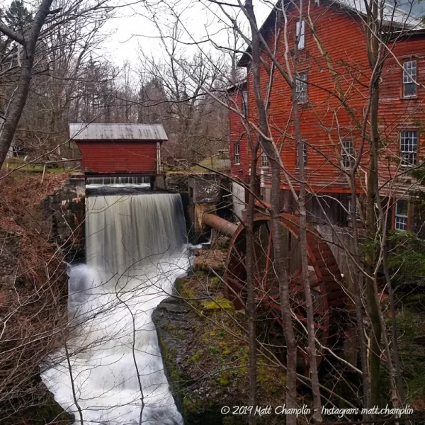Looking at the New Hope Flour Mill dam and waterfall as well as the water wheel and covered bridge above the waterfall.