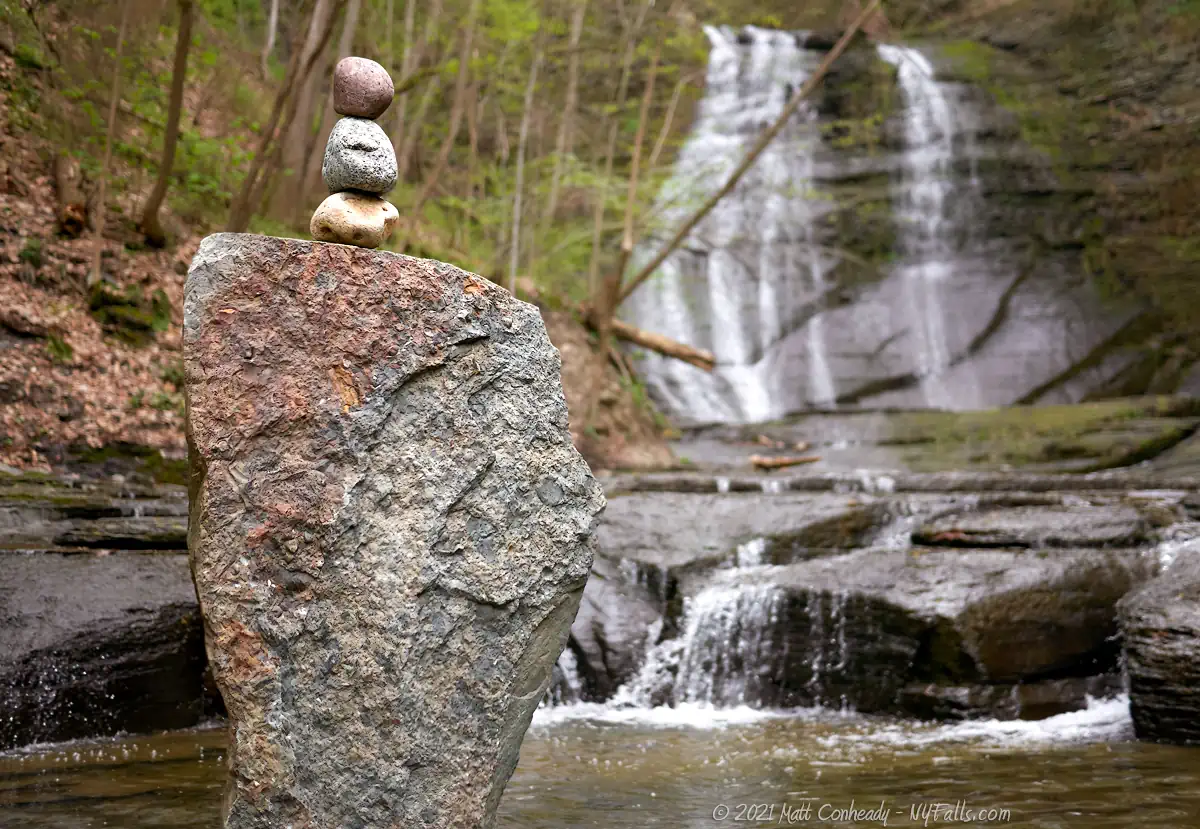 A closeup of a cairn left at the base of Lick Brook Falls in Sweedler Preserve