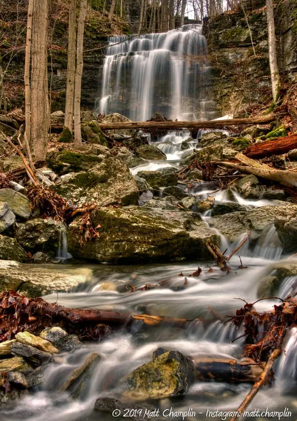 A waterfall down a rocky slope in 3 falls woods