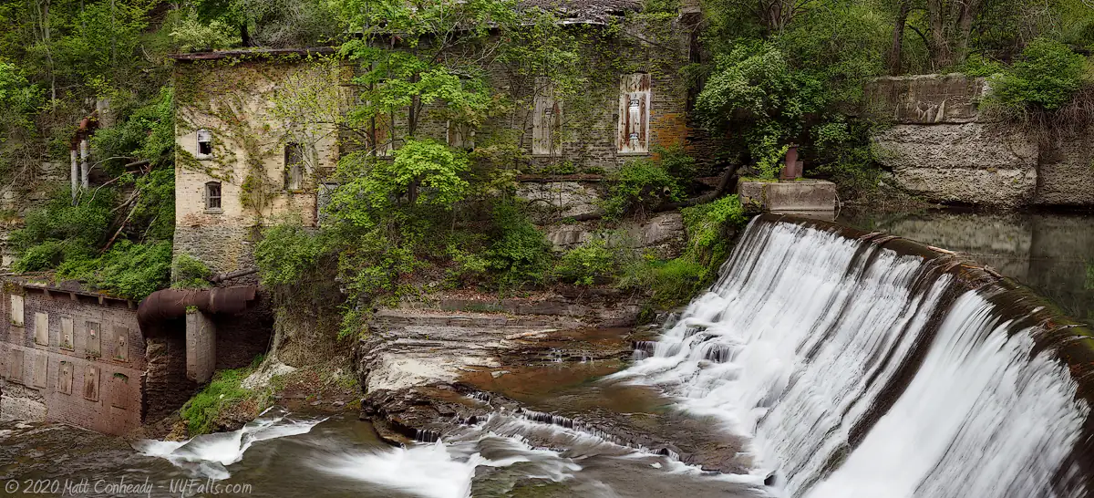 A wide view of the dam above Wells Falls and overgrown Van Netta water plant.