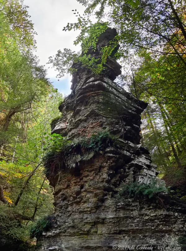 Pinnacle Rock is a towering geological formation in Buttermilk Falls Gorge