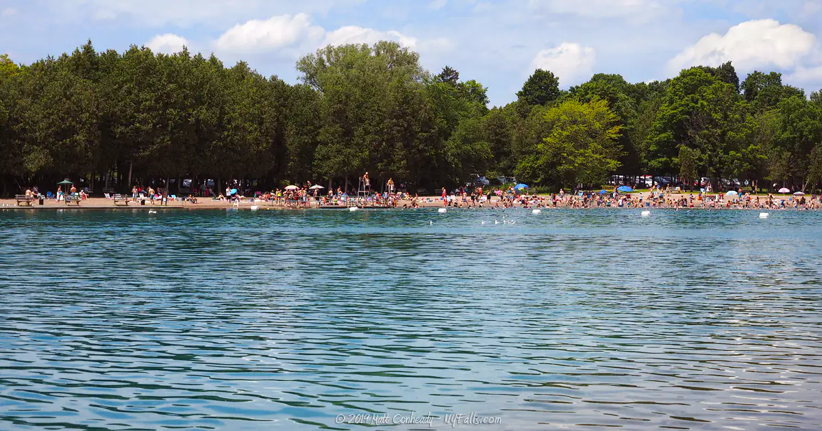 A very crowded swimming beach on hot July day at Green Lakes State Park