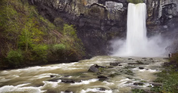 Taughannock Falls ins high flow during spring rain. The screen below the falls is almost flooded.