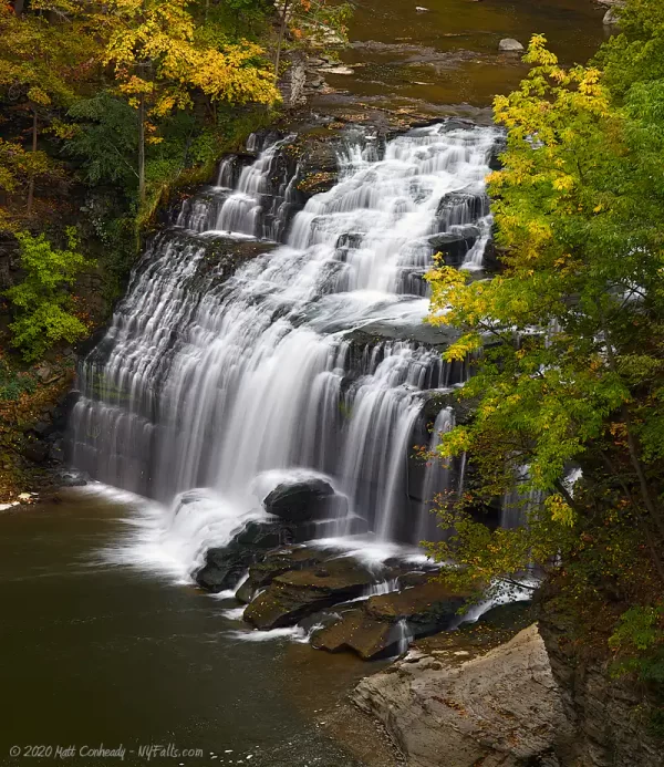 Forest Falls on Fall Creek Gorge, in moderate flow, shot in early fall season from the Stewart Ave Bridge.