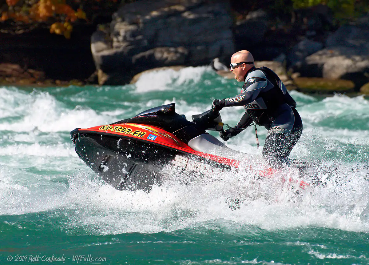 A man on a jet ski riding up the Niagara rapids at Devil's Hole