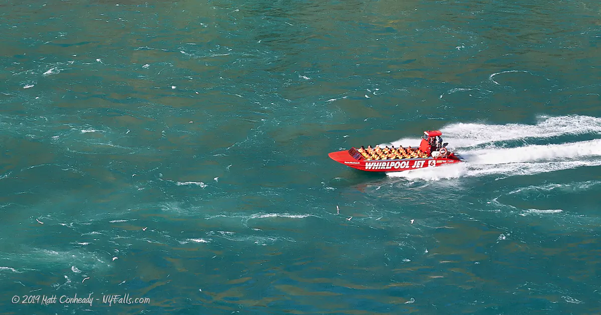 Whirlpool Jet Boat skimming along the Niagara River at Devil's Hole.
