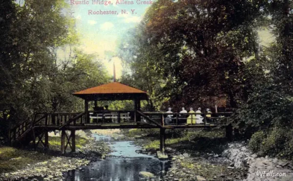 A vintage postcard view of wooden bridge over Allens Creek in Corbetts Glen