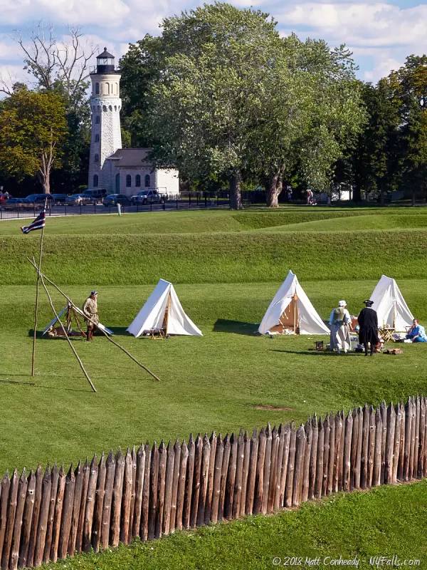 Encampment just outside the walls of Fort Niagara, with the historic lighthouse in the background