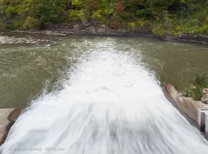 The Genesee river flowing through the hydroelectric plant that caps Rochester's Middle Falls