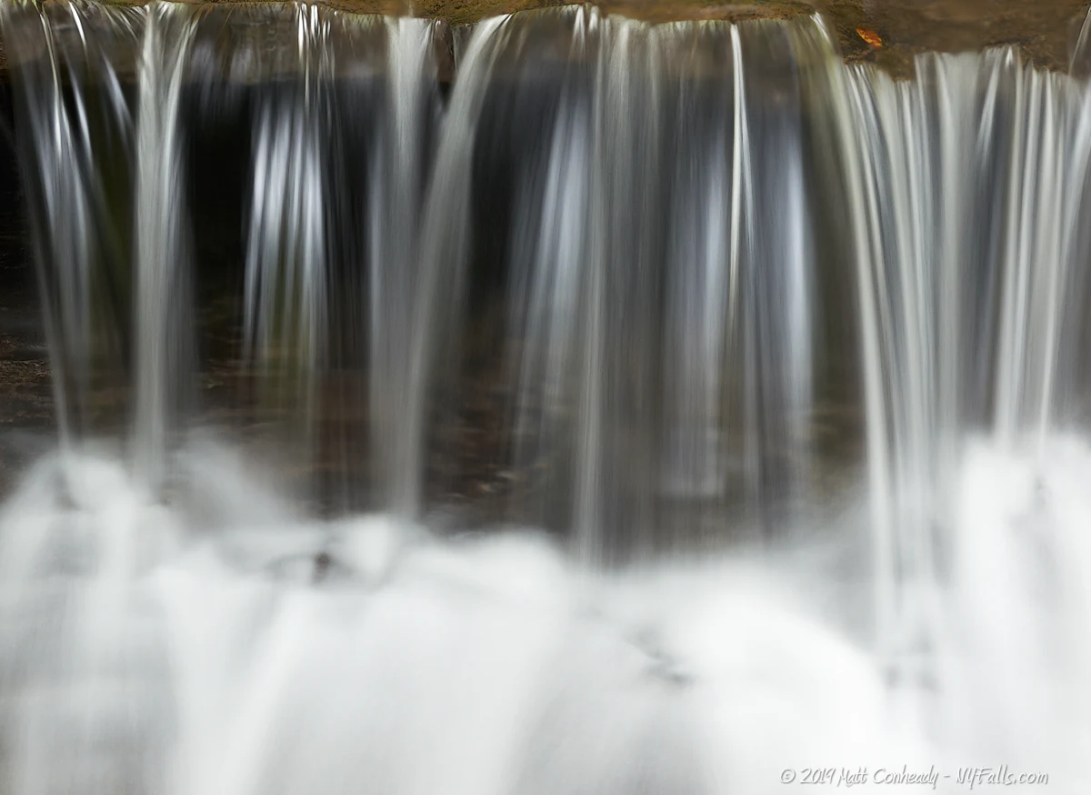 A closeup of a small waterfall.