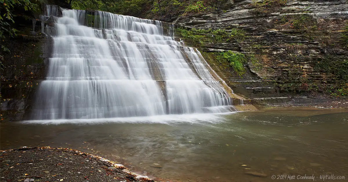 A view of one of the larger waterfalls in Stony Brook State Park, taken from the side opposite of the gorge trail. There's a large pool at the bottom.