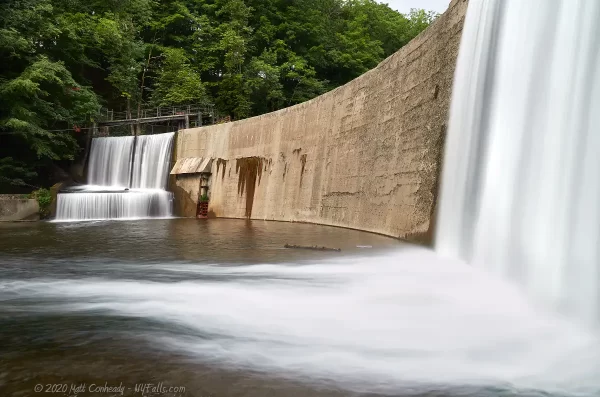 The dam on Wiscoy Creek, shot from the wise, with two distinct and smooth waterfalls.