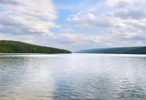 A wide view of Hemlock Lake on a very calm day.