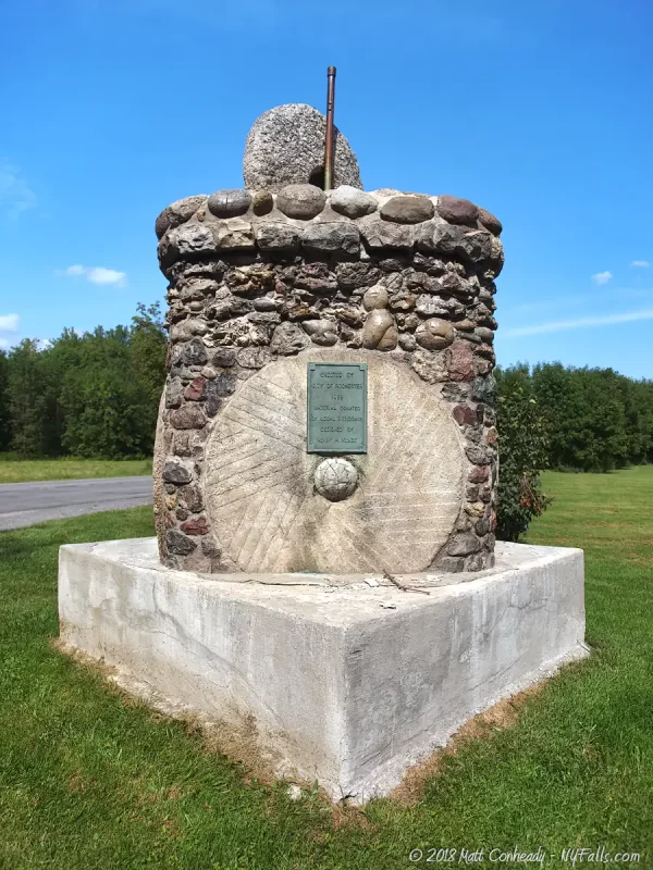 A mill Stone and Historic Marker at Hemlock Lake Park.