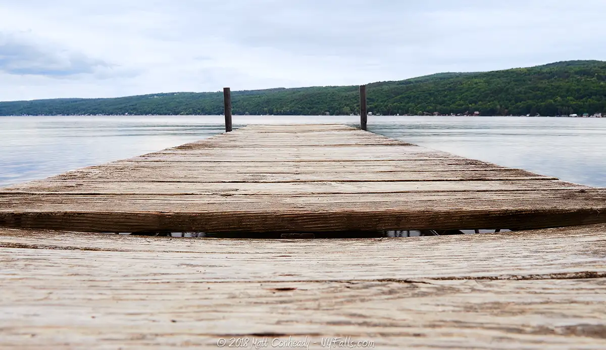 A wooden dock over Keuka Lake at Champlin Champlin Park in Hammondsport