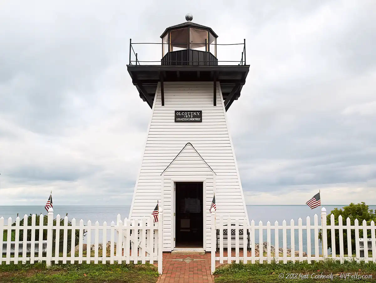 A reconstructed Olcott Lighthouse on a cloudy day.