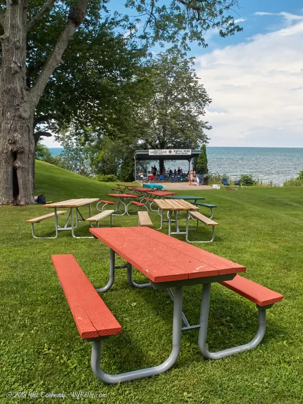Picnic tables, bandstand, and Lake Ontario at Krull Park.