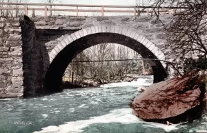 Lover's Retreat and the 1940s stone arch bridge over Flint Creek.