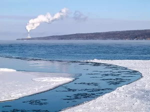 Looking across Cayuga Lake from Taughannock Falls State Park on a cold winter day towards the Milliken Station, which is now decomissioned.