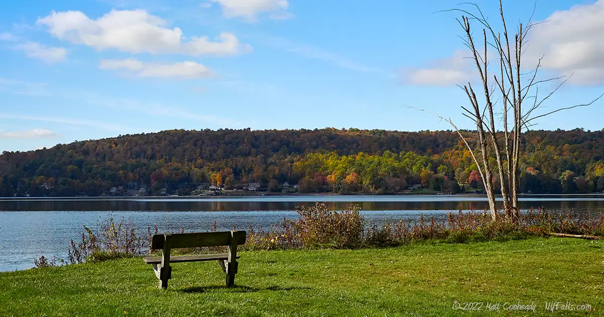 A bench along Otisco Lake County Park