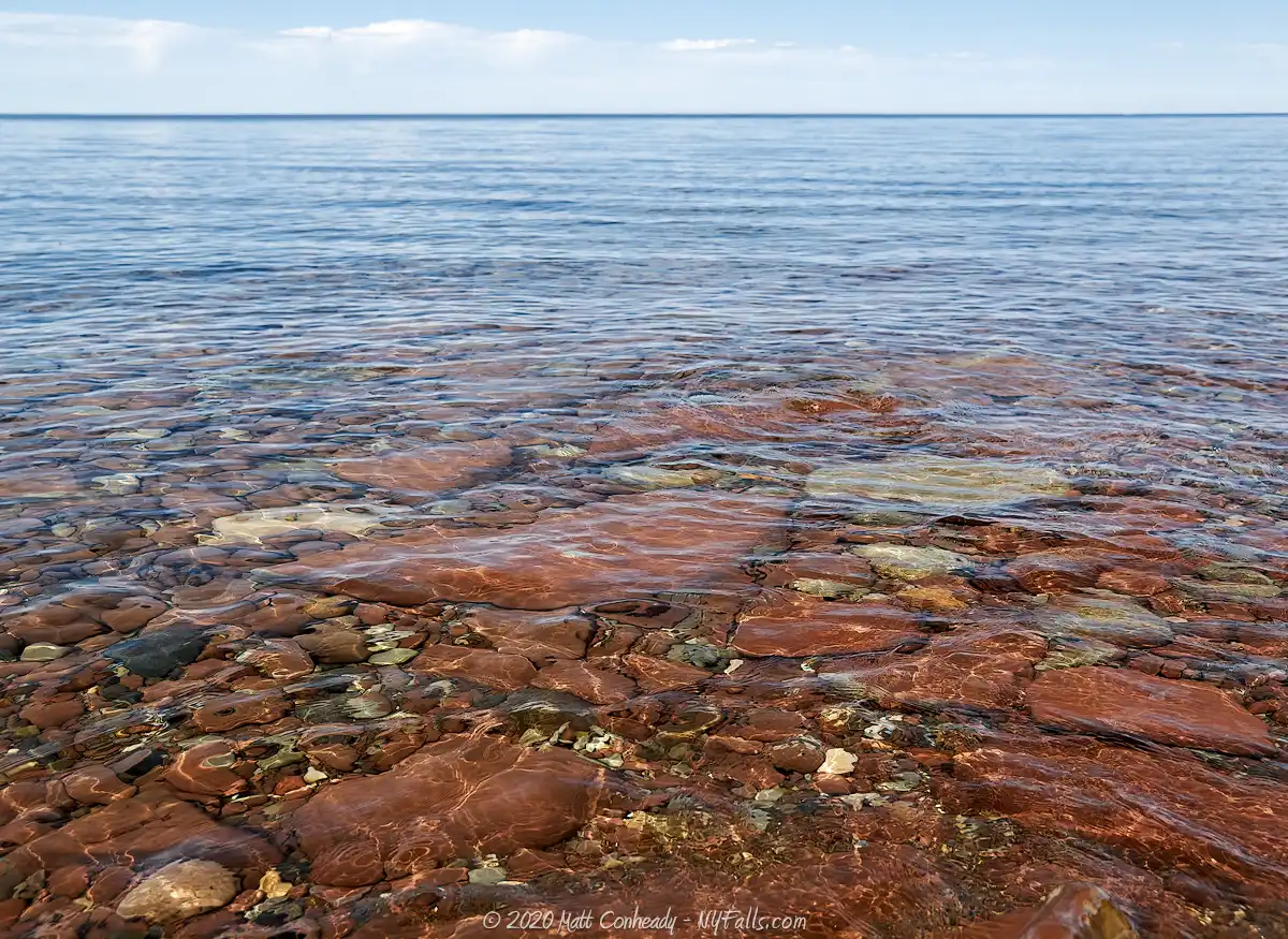 A view of Lake Ontario and the red stones of B. Forman Park