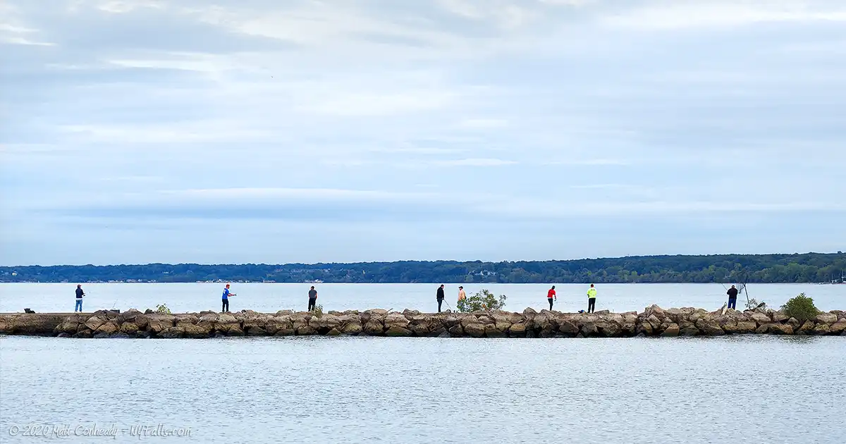 Fishermen along the breakwall on Lake Ontario