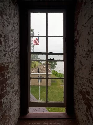 Looking out the window of the Thirty Mile Point Lighthouse tower.