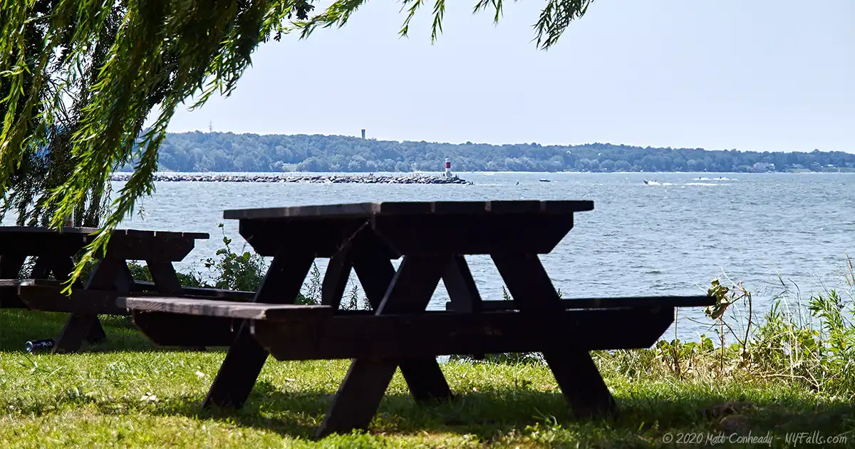A picnic table with a view of Lake Ontario at Sandbar Park in Webster