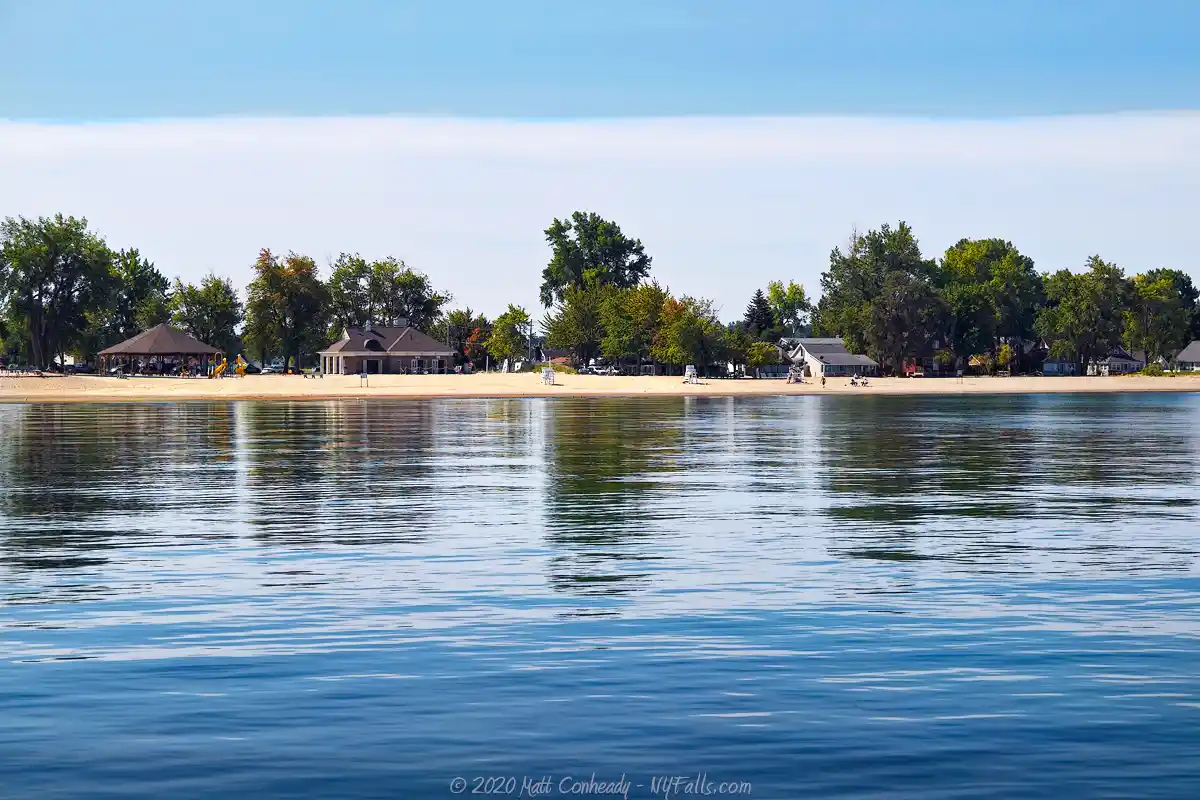 Sodus Point Beach park with calm water of Lake Ontario (shot from the pier)