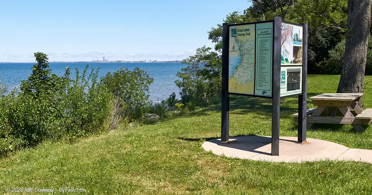 Informational signage and a picnic table with view of the lake adjacent to the Lake Erie Seaway Trail Visitor Center
