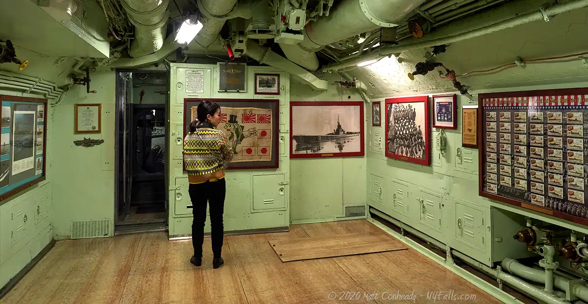 A visitor looks over historic mementos and neoformation aboard the USS Little Rock at the Buffalo-Erie Naval & Military Park.