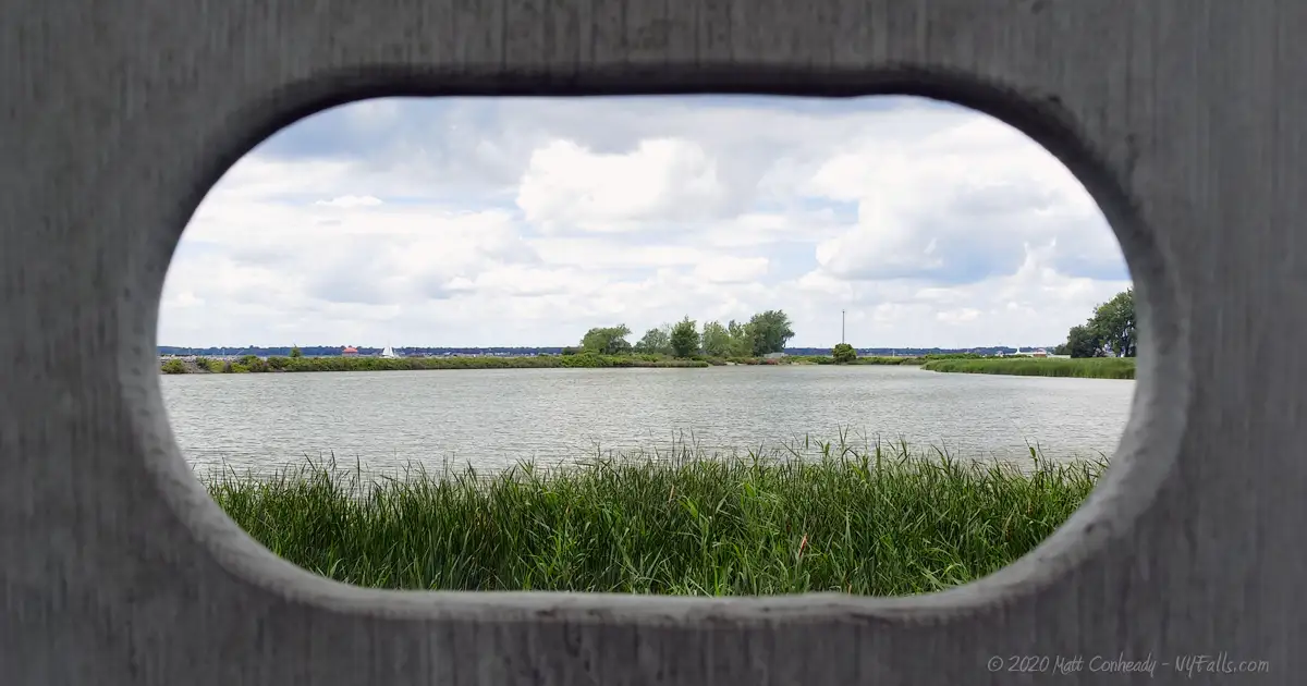 A view through the bird-watching blind looking over the pond at Times Beach