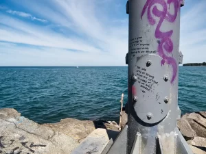 A close up of some graffiti on the light beacon at the end of the break wall at Cattaraugus Creek Harbor