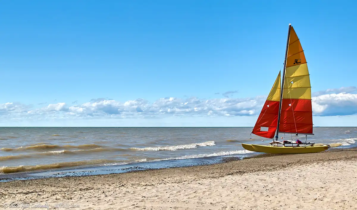 A sailboat beached on a sunny day at Evangola State Park