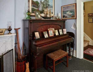 A piano in the living room of the keeper's quarts of the Dunkirk, Lighthouse.