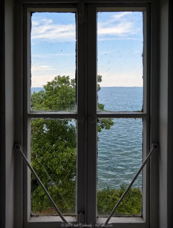 A view looking out the window of the Dunkirk Lighthouse towards Lake Erie